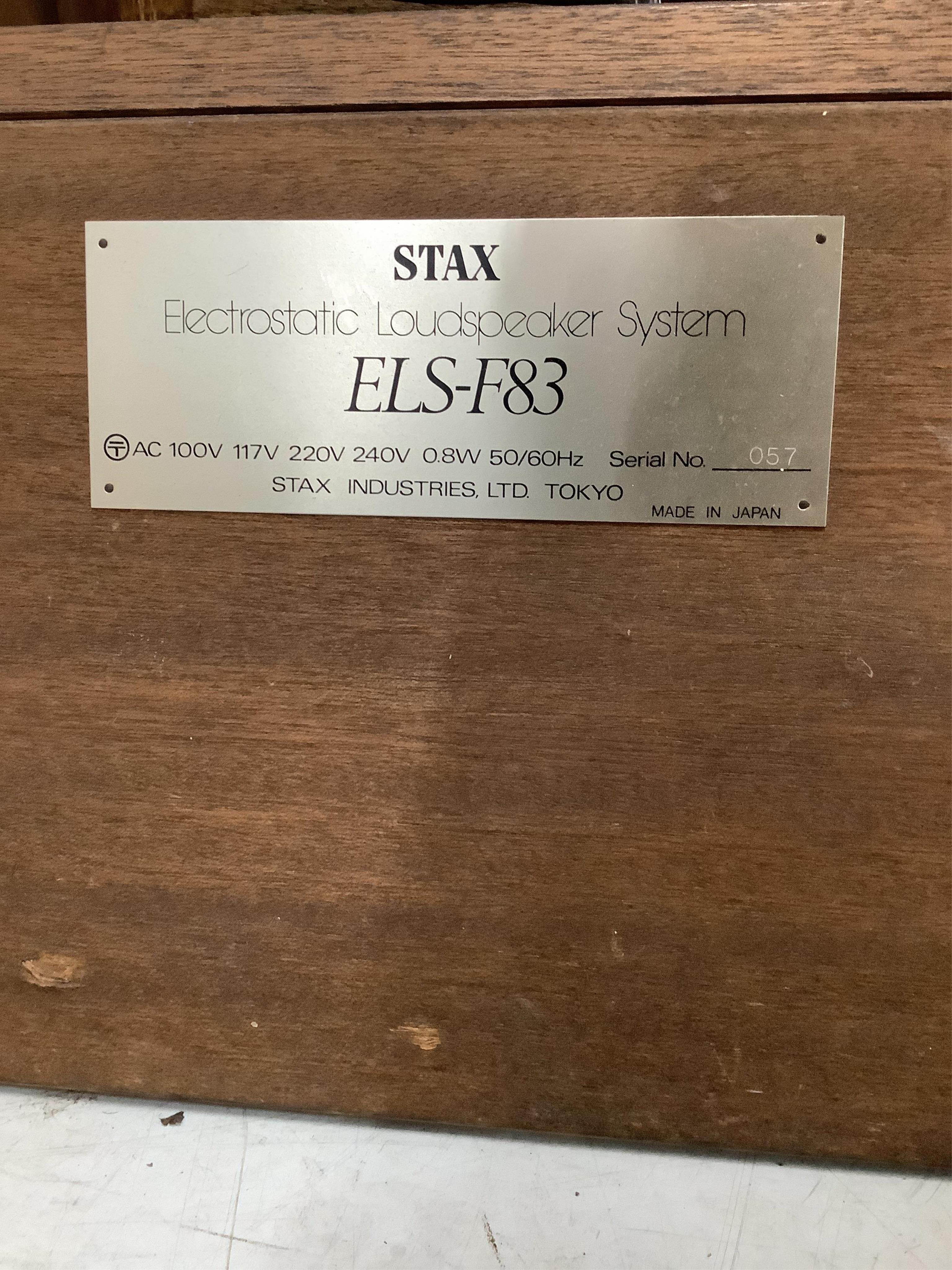 A large pair of floor standing Stax ELS-F83 Electrostatic Stereo speakers, 194cm high. Condition - fair, minor wear to fabric speaker covers, sold untested.